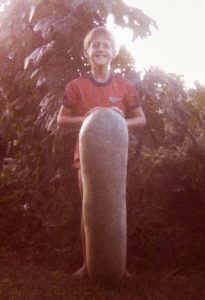 Myself around 8 years old with a Giant Tropical Cucumber